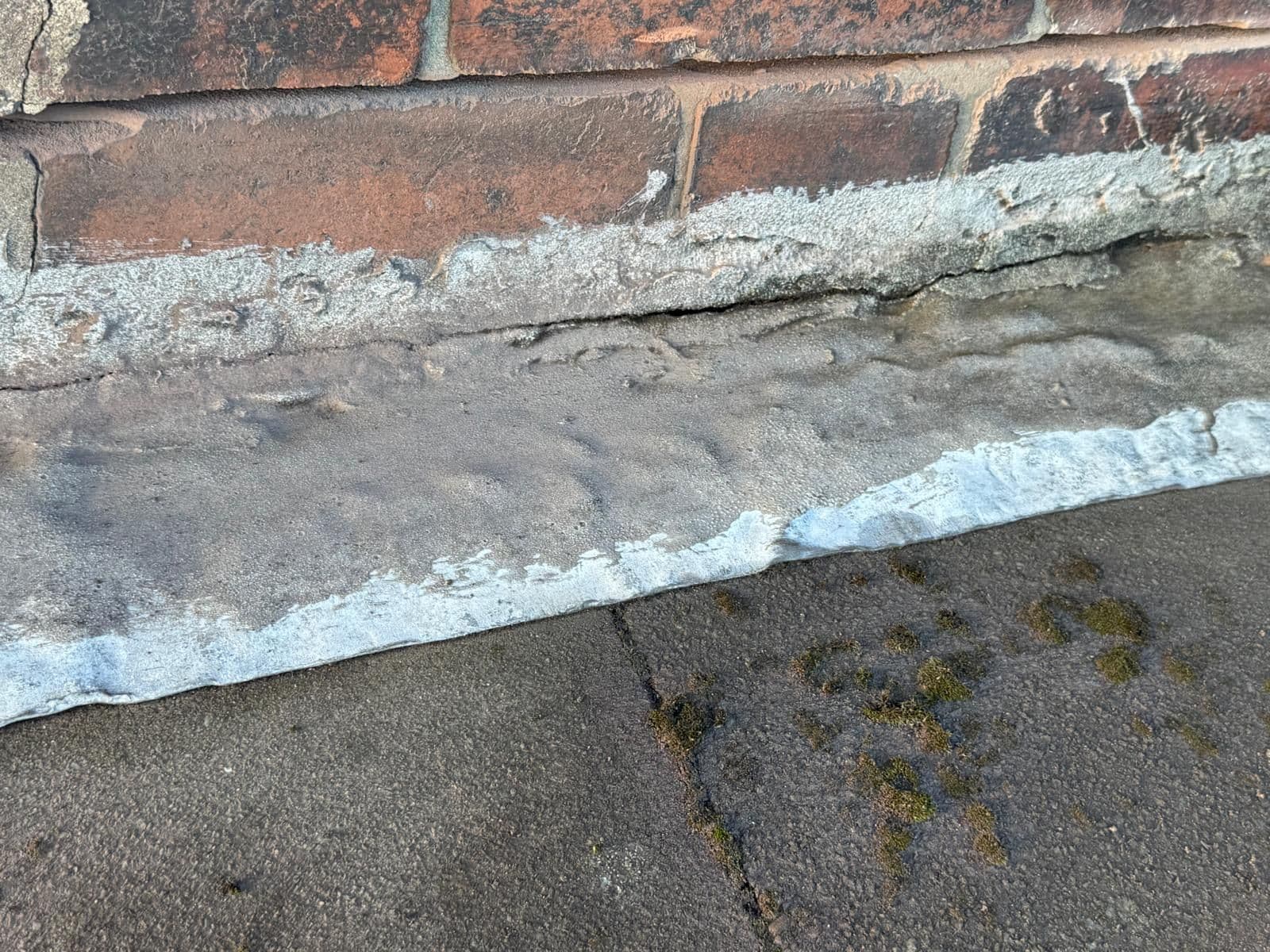 Close-up: Damaged flashing vs. fresh lead — After